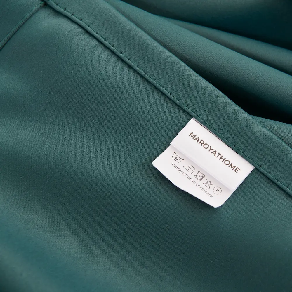 Ruben verduisterende gordijnen met ringen donker groen merklabel